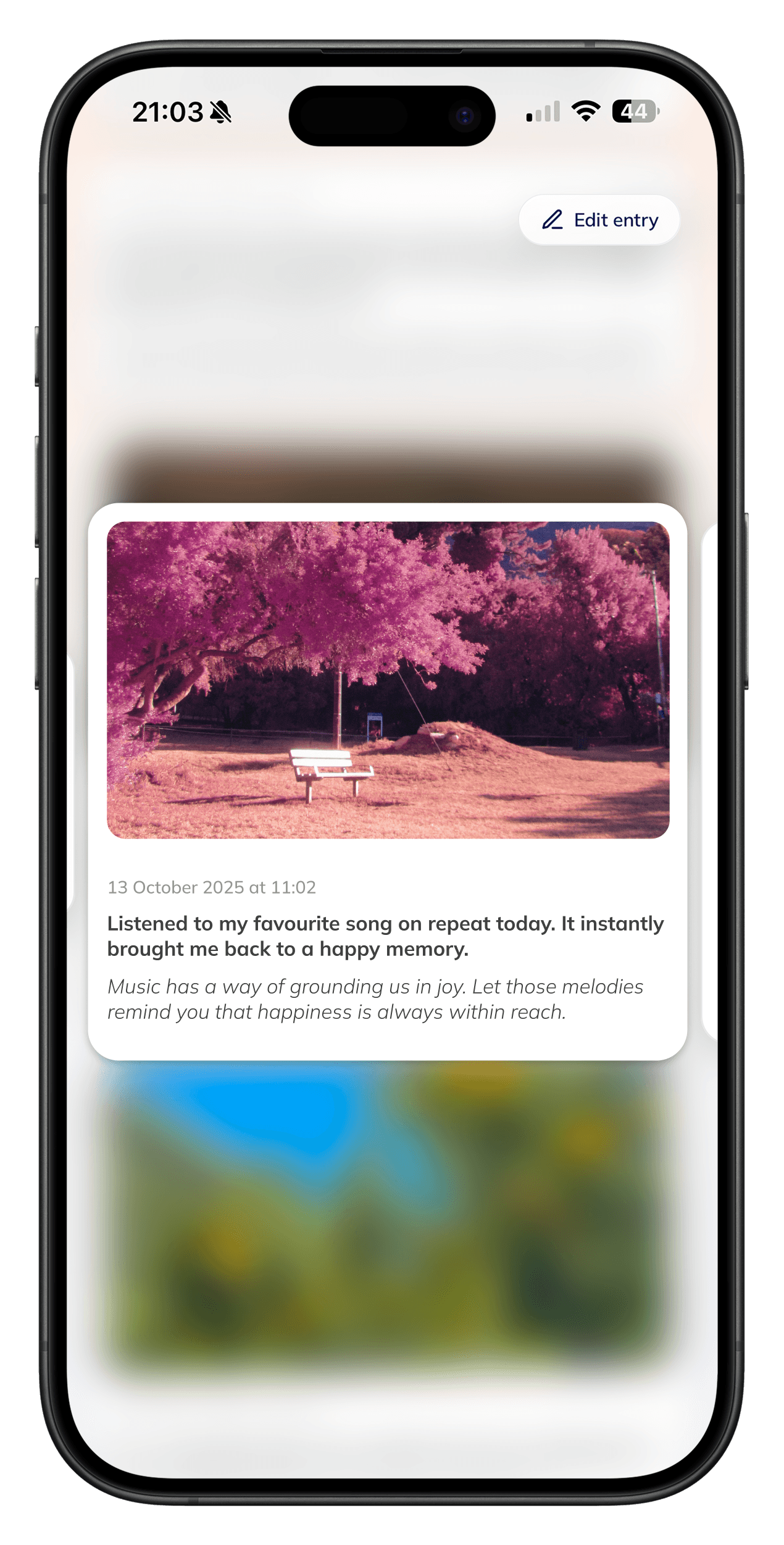 Person journaling while reading prompts on a tablet.