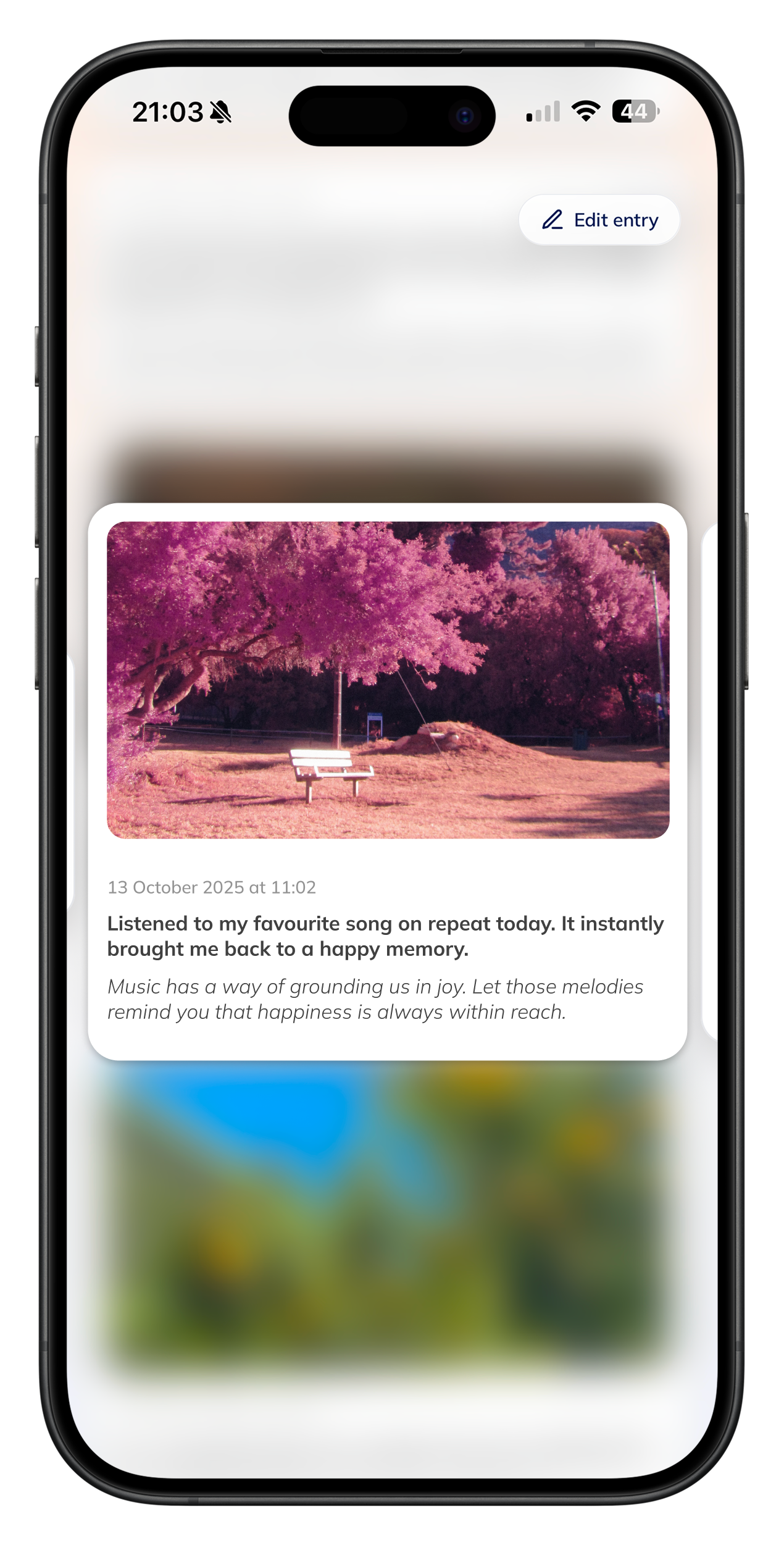 Person journaling while reading prompts on a tablet.